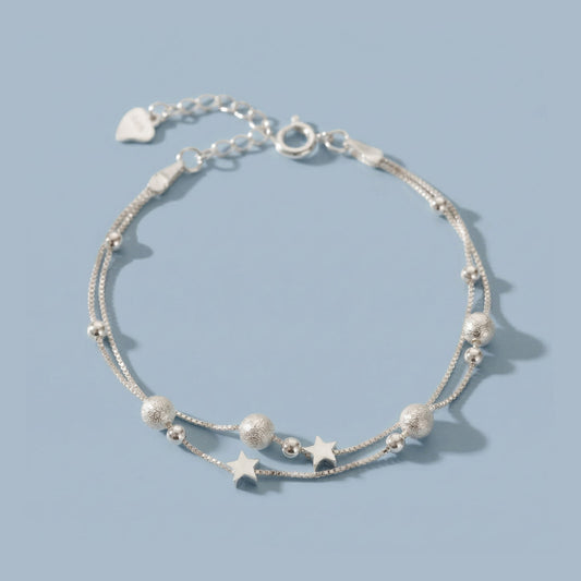 Nova - Armband mit Doppelketten und kosmischem Motiv