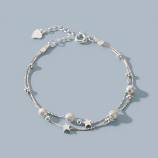 Nova - Armband mit Doppelketten und kosmischem Motiv