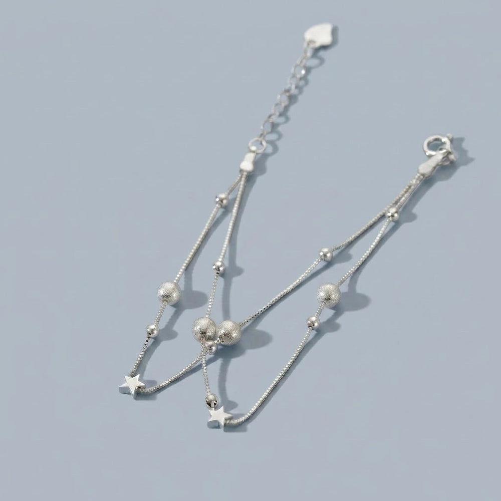Nova – Bracelet with double chains and cosmic motif